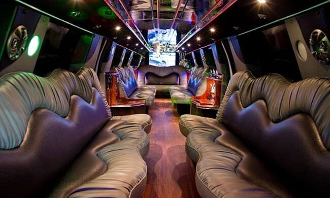 Party bus lounge interior with perimeter leather seating