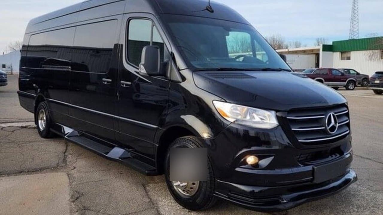 White coach bus, front three-quarter exterior, Montreal